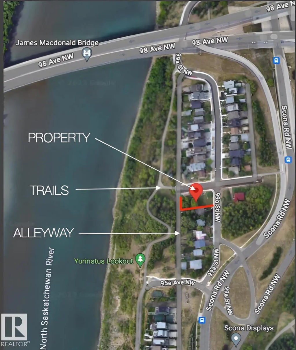 Aerial view of 9556 99A Street NW, Edmonton, labelled with PROPERTY (the marker pin), TRAILS (the river valley path system to the west), and ALLEYWAY (rear access lane). The James MacDonald Bridge to downtown is visible at the top of the image.